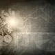 Rouages mécaniques sur fond de graphiques et de chiffres financiers en transparence