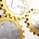 Rouages dorés en forme de pièces d'un euro engrenés les uns dans les autres